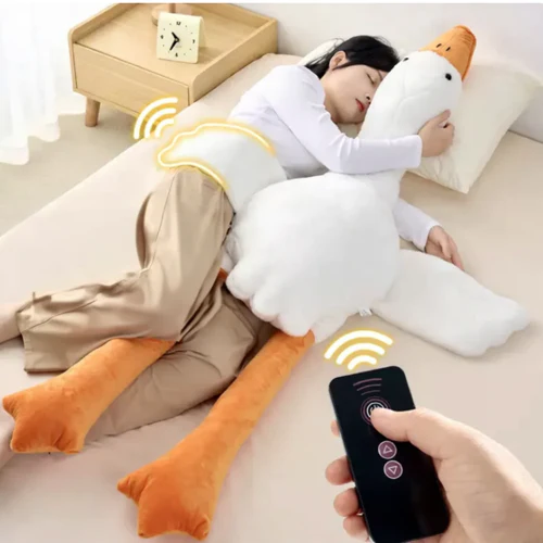 Hug Taps plushie with glowing heartbeat sitting on a cozy bed